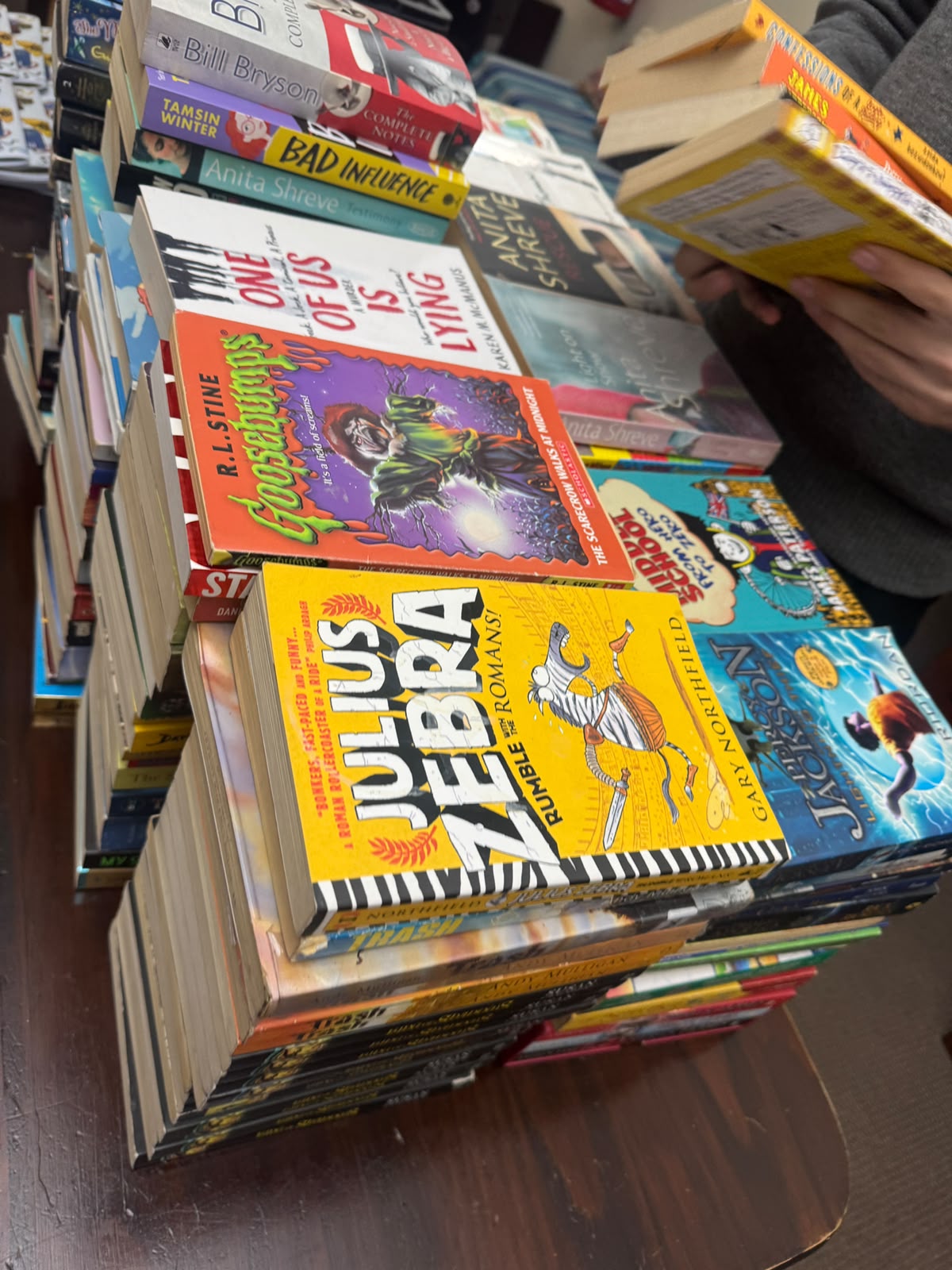 A school partner preparing books and learning resources